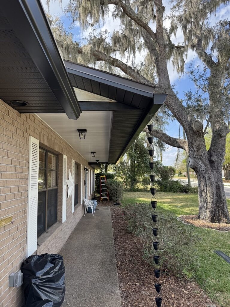 Completed gutters beneath a large oak tree in Central Florida